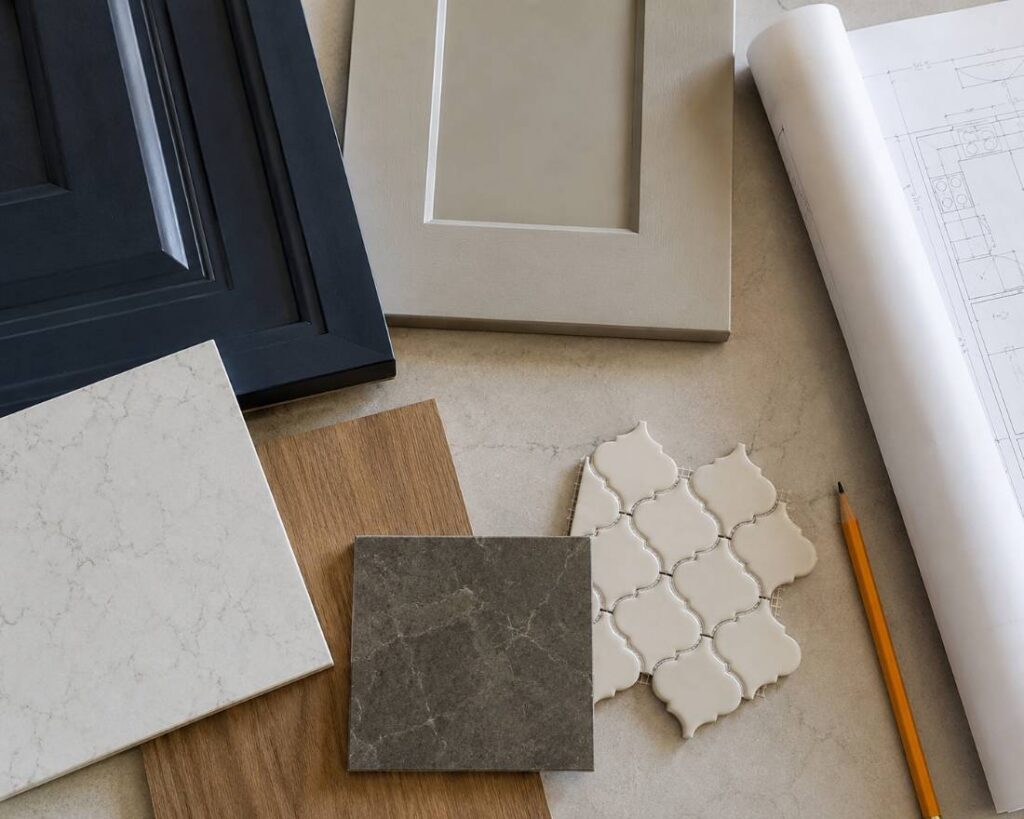Homeowner reviewing cabinet and finish samples during kitchen remodel planning